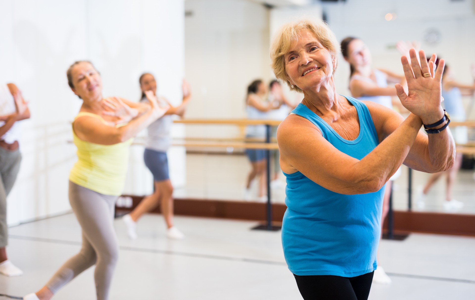 Portrait of an mature European woman enjoying energetic dancing in the studio